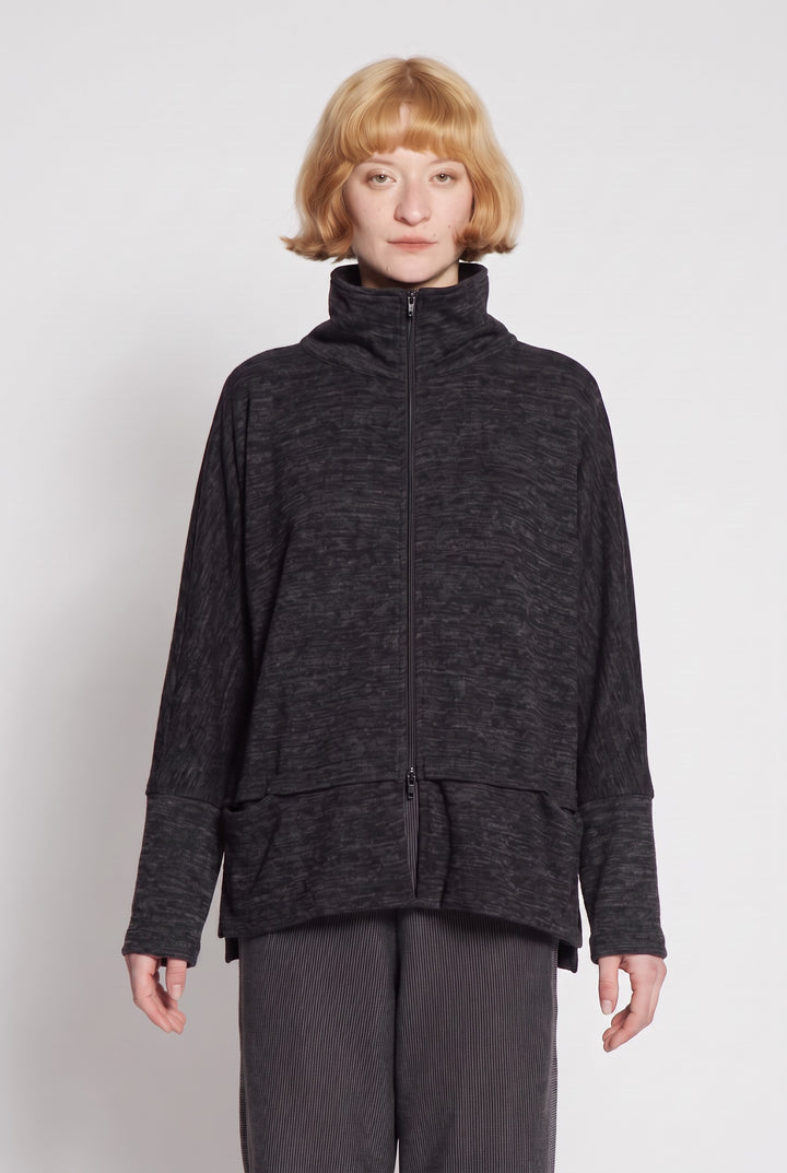 Model wearing Just Perfect Collection Online Amara black heather zip swing jacket with high collar and front pockets