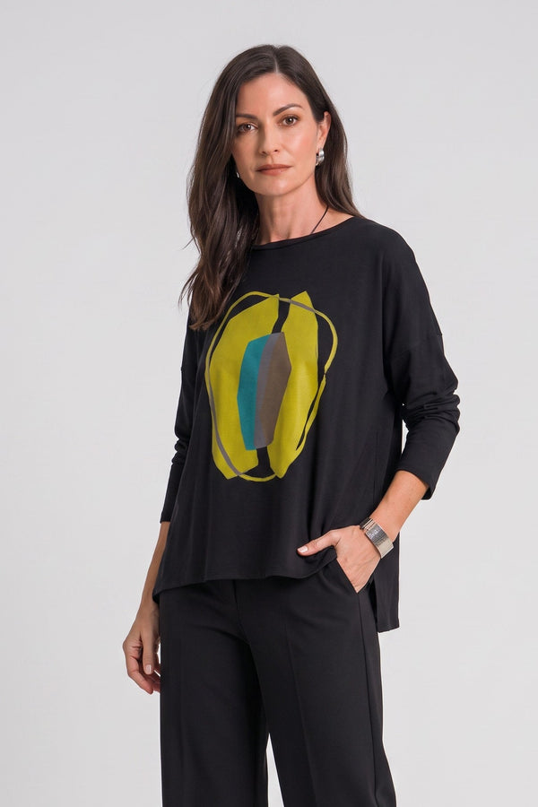 Model wearing Just Perfect Collection Online black Pima cotton boxy tee with abstract avocado graphic and long sleeves