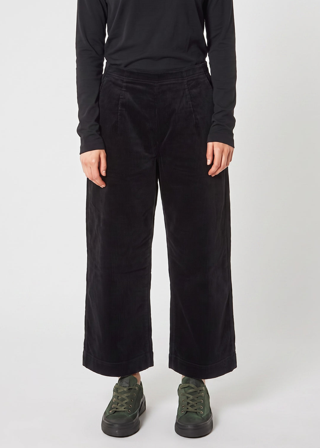 Just Perfect Collection Online black corduroy flat front trousers with a wide-leg silhouette on a model