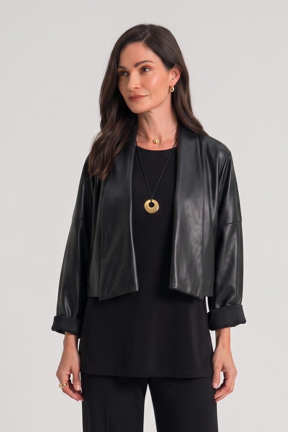 Model wearing a Just Perfect Collection Online black Origami jacket with structured geometric lines and rolled sleeves