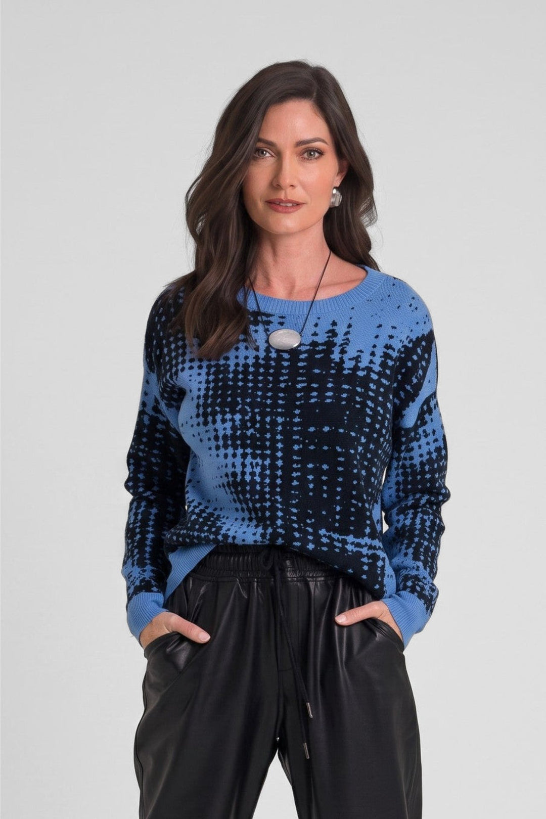 Model wearing Just Perfect Collection Online blue and black geometric pima cotton sweater with black joggers