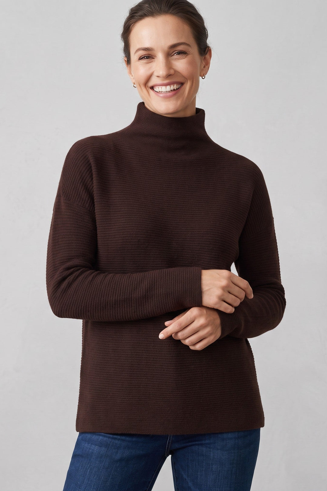 Just Perfect Collection Online chocolate brown cashmere funnel neck sweater with textured knit on a smiling woman.