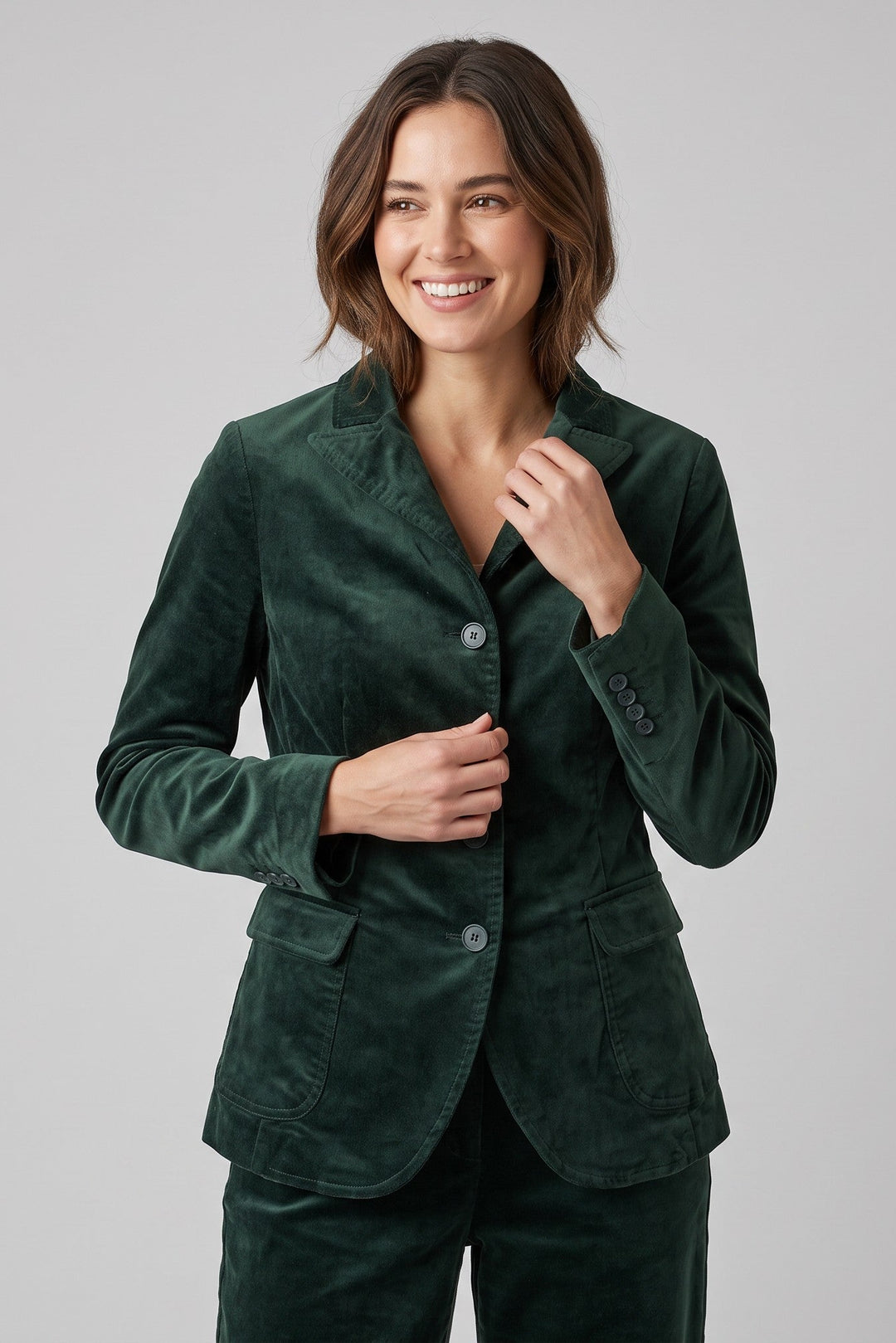 Just Perfect Collection Online forest green tailored velvet jacket with lapel collar and button front on a model