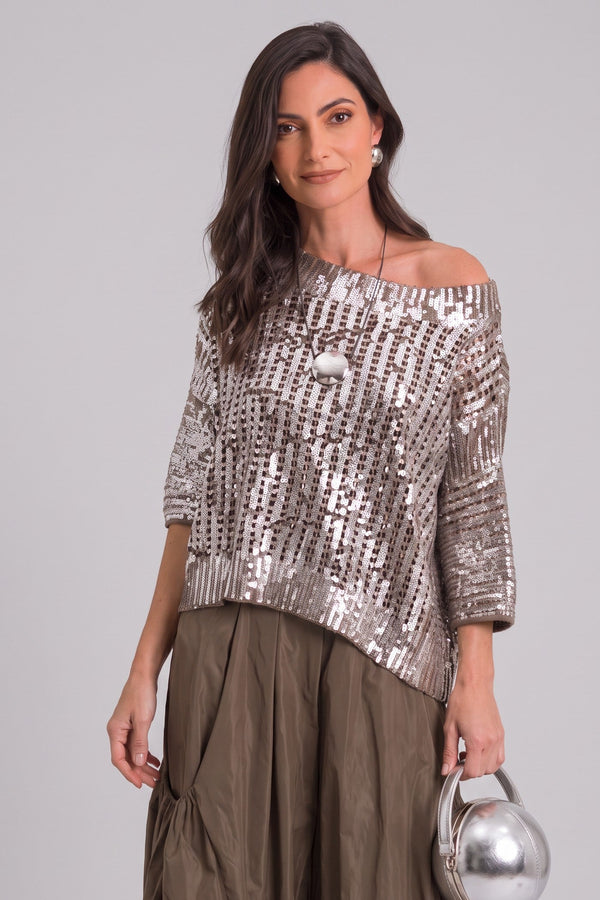 Model wearing a Just Perfect Collection Online metallic crochet sweater with a wide neckline and three-quarter sleeves