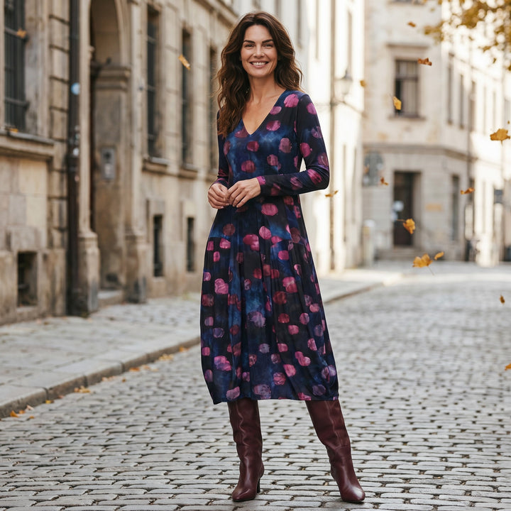 Just Perfect Collection Online V-neck midi dress in midnight blue with pink abstract print and bubble hem on a woman