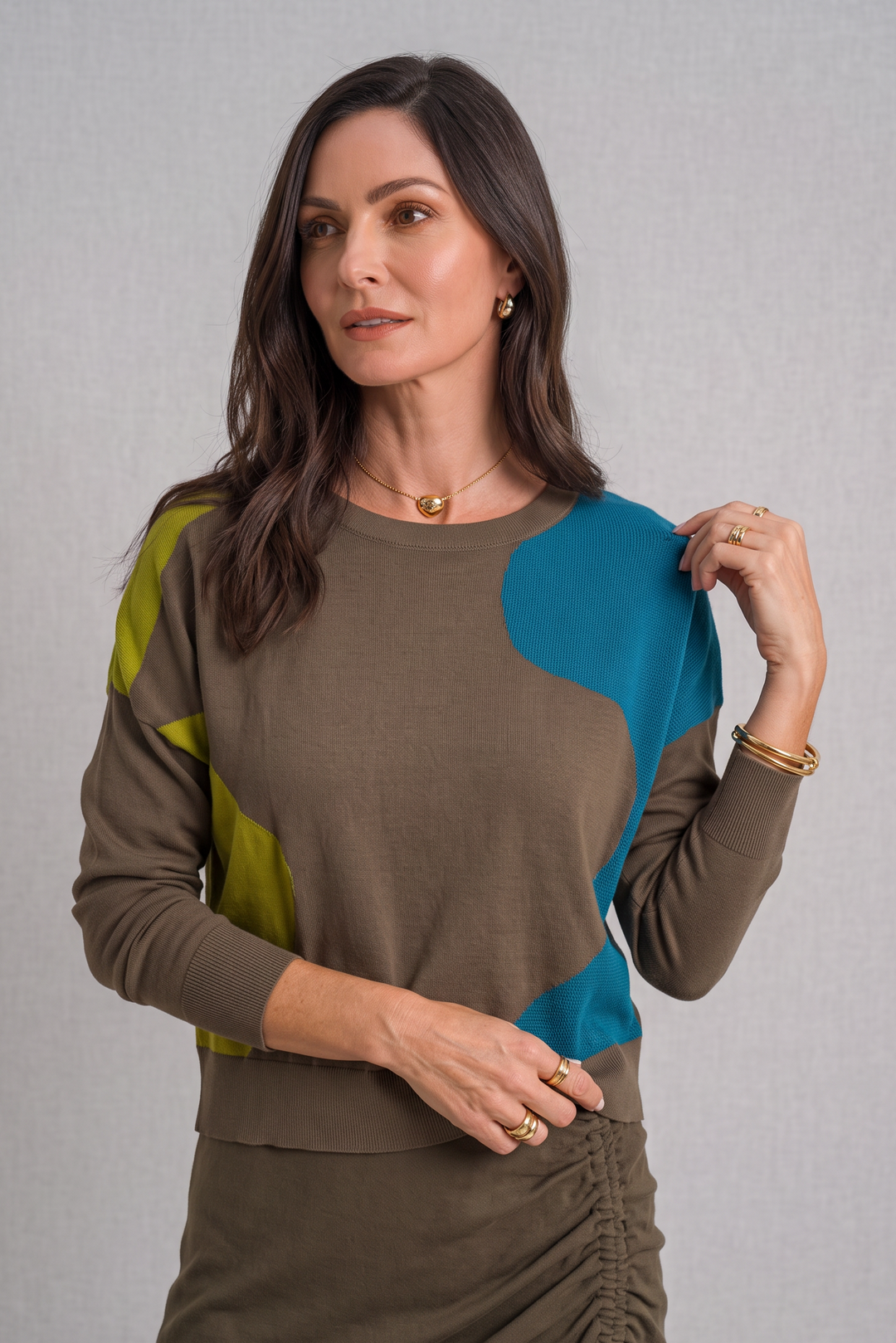 Model wearing Just Perfect Collection Online Pima cotton sweater with olive, blue, and lime green abstract oval pattern.