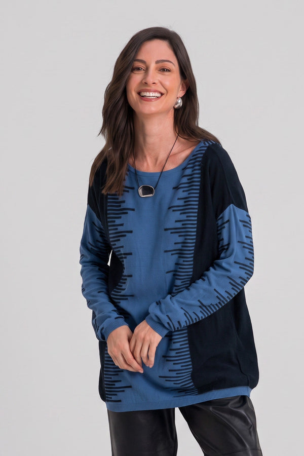 Just Perfect Collection Online Pima cotton long sweater in marina blue with black flat line pattern on a smiling model