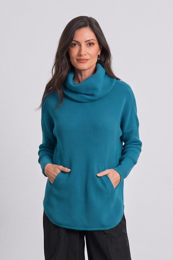Model wearing a Just Perfect Collection Online teal Pima cotton waffle-knit cowl neck sweater with a curved hem.