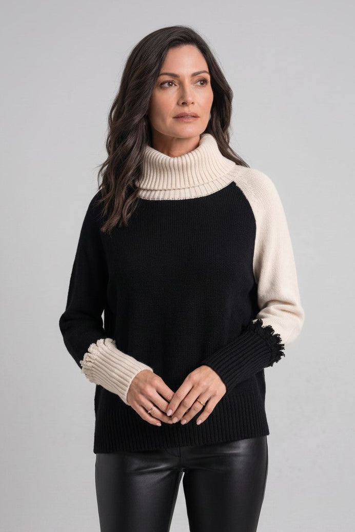 Just Perfect Collection Online two-tone Pima cotton turtleneck in black and cream worn by a woman