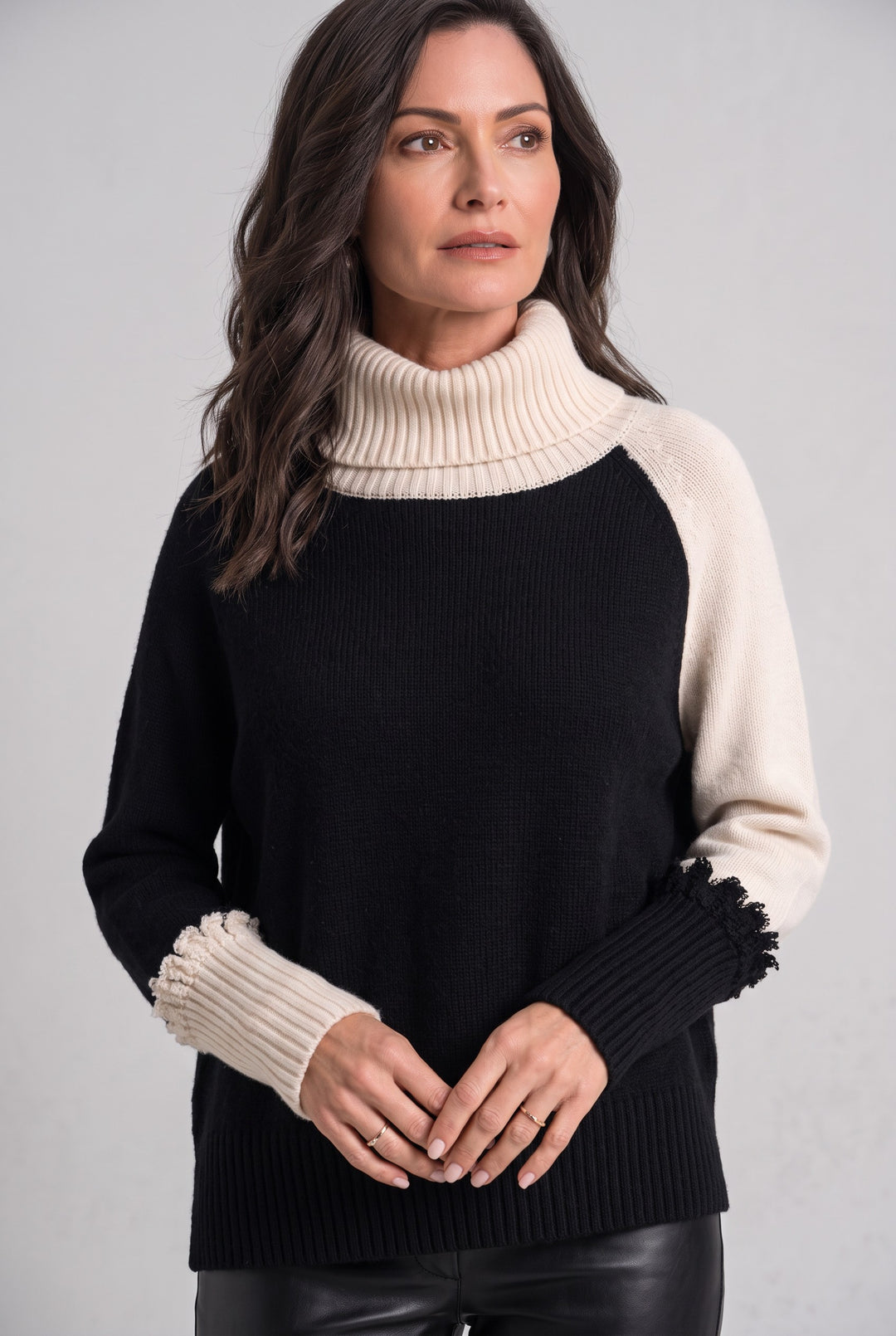 Just Perfect Collection Online two-tone Pima cotton turtleneck sweater in black and cream with ribbed cuffs